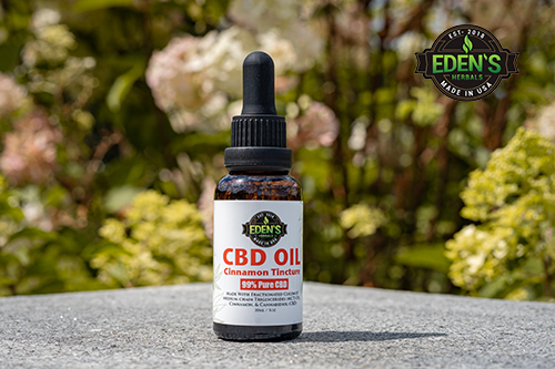 Eden's Herbals CBD Oil Tincture sitting on granite block outdoors