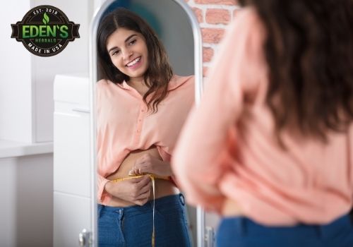 Woman looking at weight loss results from cbd
