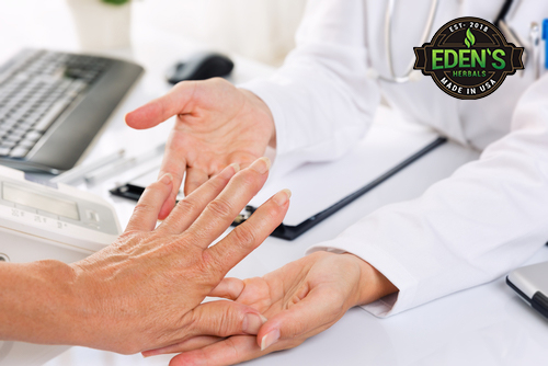 Doctor treating hand pain with CBD 