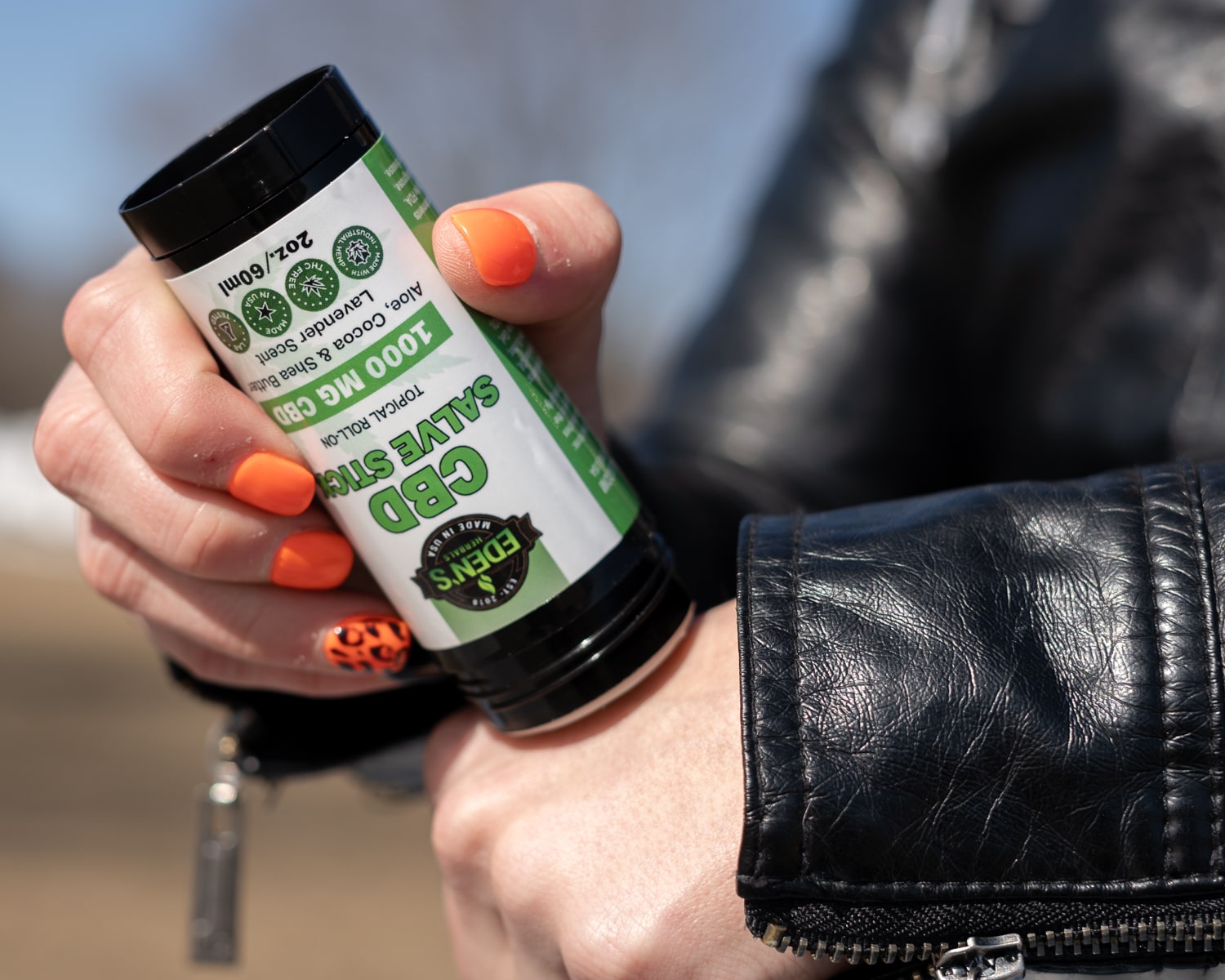 Woman uses CBD hand salve for fighting inflammation