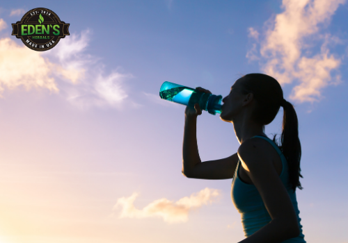 Woman drinking CBD water for fitness