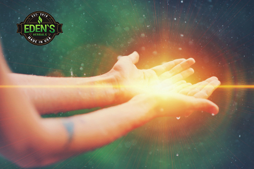 Hand holding energy from all natural healing