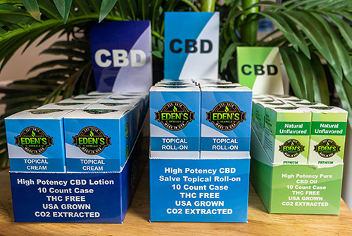 CBD Display boxes from Eden's Herbals with CBD Oil Tinctures, CBD Roll on Salve, and CBD Body Lotion