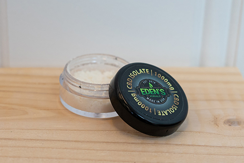 open jar of CBD isolate powder from Eden's Herbals