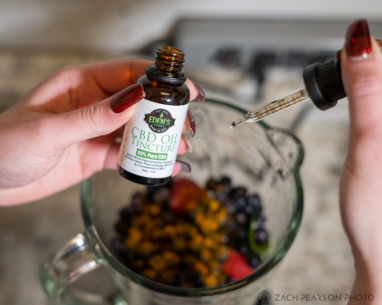 CBD oil being added to a CBD fruit smoothie