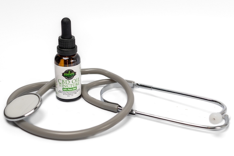 Eden's Herbals CBD Oil Tincture 1000mg with a stethoscope