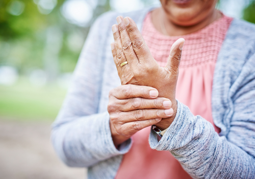 Closeup of elderly womans hands suffering from arthritis