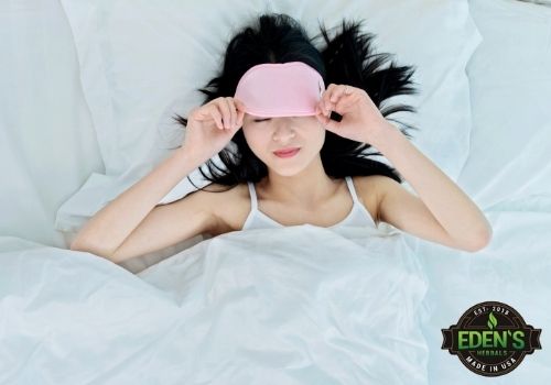woman sleeping with eye mask half on half off