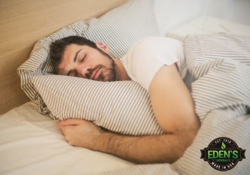 man sleeping in bed