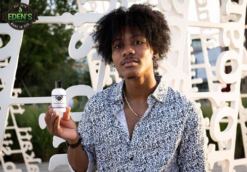 man modeling with eden's herbals cbd lotion