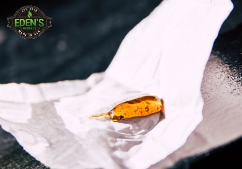 CBD wax in a ball on a crumpled piece of paper