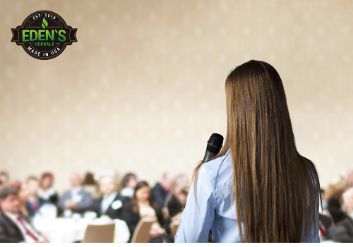 Woman using CBD to overcome anxiety from public speaking 