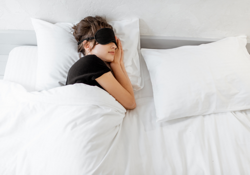 Woman sleeping with face mask on