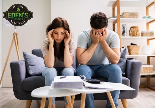 Couple sitting stressed out on couch