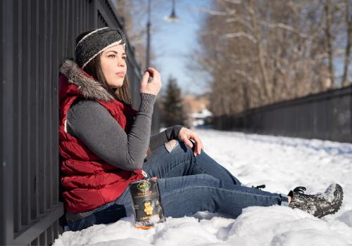 Woman taking CBD gummies for PTSD