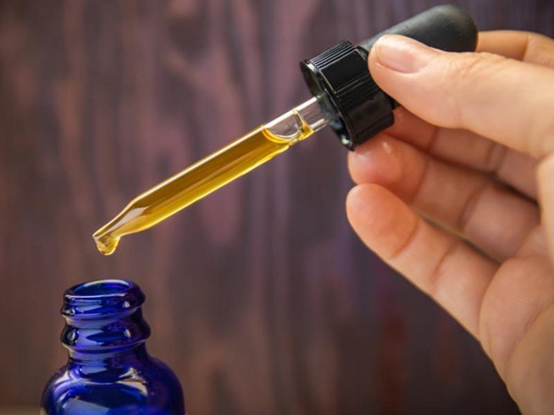 CBD oil being drawn from a tincture