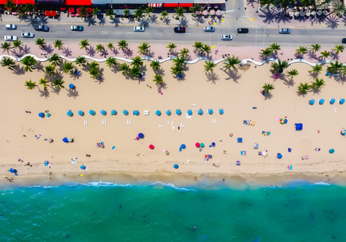 Overhead long angle shot of Florida beach with bright blue ocean