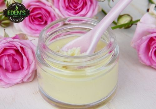 Lotion jar surrounded by roses