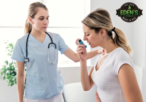 woman using inhaler at doctors office