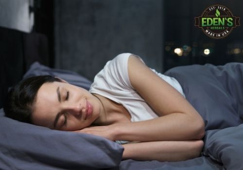 Woman sleeping in bed focusing on her rest
