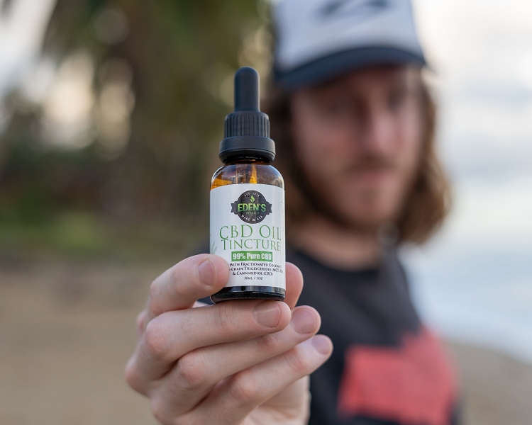 Man offering CBD oil for opiate withdrawal symptoms