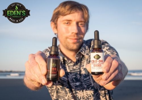 Man holding two Eden's Herbals CBD Oils