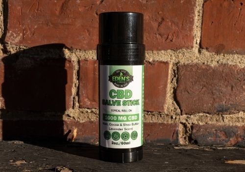 Roll on CBD salve stick with brick background