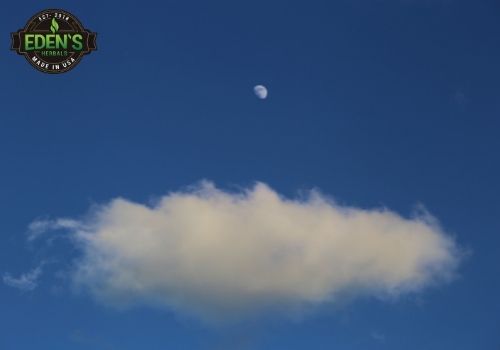 clouds in a night sky under the moon