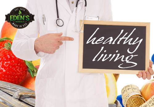 Doctor with fruit and sign about healthy living