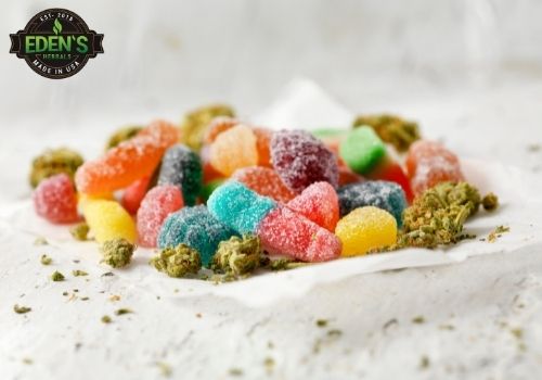 gummies in a bowl with hemp leaves