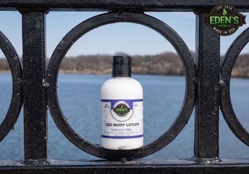 Eden's Herbals CBD Lotion in nature at lake