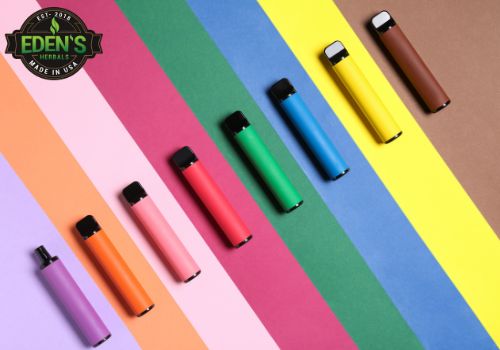 Different colorful vapes lined up in a rainbow form