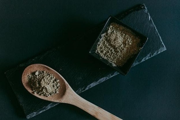 All natural kratom powder on a spoon