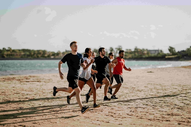 Runners on a beach racing