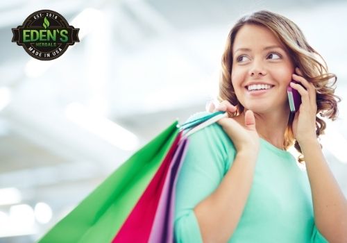 Woman shopping for CBD with multiple bags