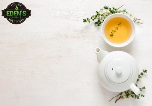 tea with herbs surrounding it