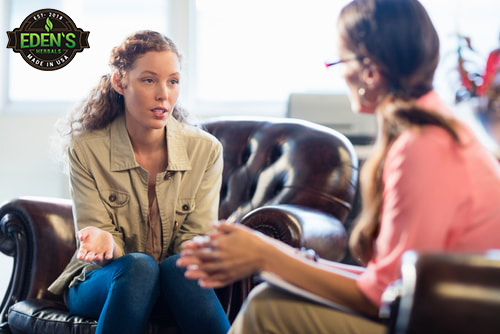 Young woman talking to therapist to treat depression