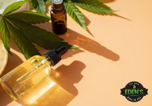 cbd bottles laying on a bright table in the sunlight
